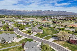 Aerial perspective of suburban area with a water and mountain view