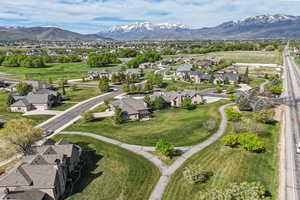 Aerial overview of property's location with nearby suburban area and mountains