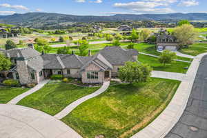Aerial view of residential area featuring a mountain backdrop