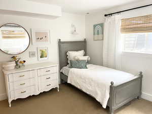 upstairsBedroom featuring carpet