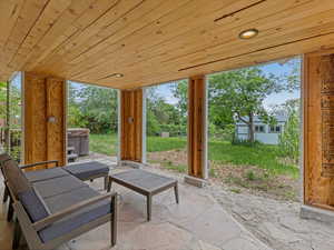 View of patio / terrace with a hot tub
