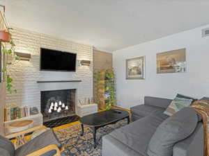 Living area featuring a fireplace and wood finished floors