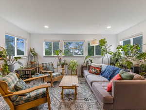 Living room with recessed lighting and wood finished floors