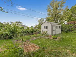 View of shed with a garden