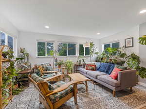 Living area featuring recessed lighting and baseboards
