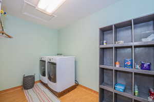 Laundry area featuring attic access and independent washer and dryer