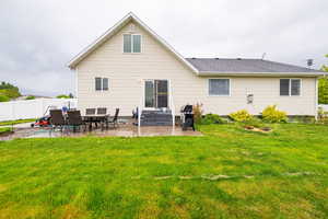 Rear view of house with a patio