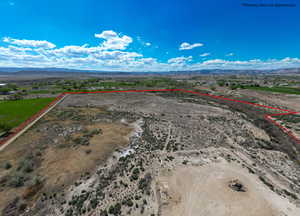 View of rural area with property boundaries highlighted and a mountain backdrop