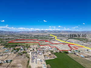 Aerial view of property's location featuring mountains and property parcel outlined