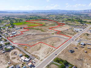 Aerial overview of property's location featuring property parcel outlined and mountains