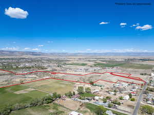Aerial view of property's location featuring property parcel outlined and mountains