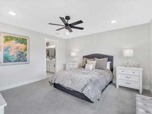 Carpeted bedroom featuring baseboards, recessed lighting, ensuite bathroom, and ceiling fan