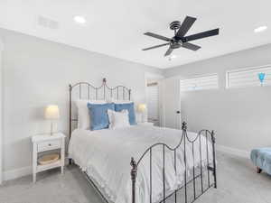Bedroom with carpet, baseboards, recessed lighting, and ceiling fan