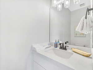 Bathroom with vanity and toilet