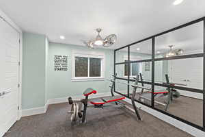 Workout room featuring baseboards and recessed lighting
