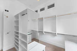Walk in closet featuring carpet