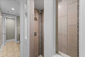 Full bathroom with tiled shower
