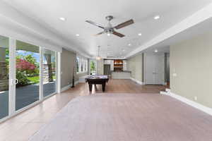 Rec room with billiards table, recessed lighting, ceiling fan, a dry bar, and light tile patterned floors