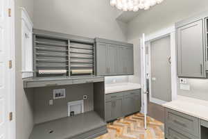 Laundry area featuring cabinet space, washer hookup, and electric dryer hookup