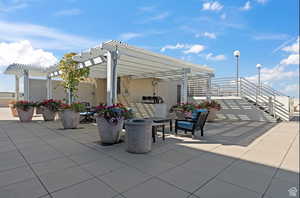 View of patio featuring a pergola and barbecue area