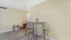 Dining room featuring wood finished floors and baseboards