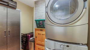 Laundry area with stacked washer / dryer