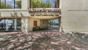 View of exterior entry featuring stucco siding