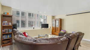 Living room featuring wood finished floors and baseboards