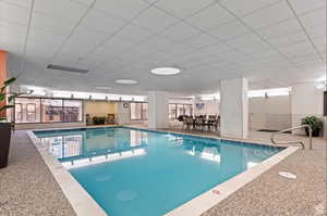 View of indoor community pool and spa
