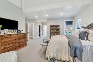 Bedroom featuring light colored carpet, access to outside, recessed lighting, and baseboards