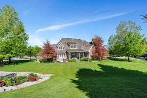 View of front of property featuring a front yard
