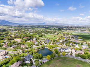 Aerial view of residential area featuring a water and mountain view