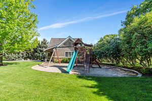 View of play area featuring a yard