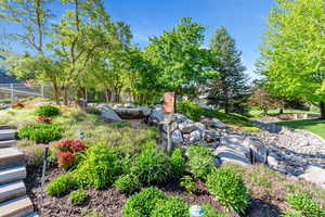 View of yard featuring fence