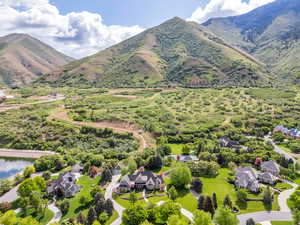 Aerial perspective of suburban area with a mountainous background