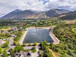 View of mountain background featuring nearby suburban area and a large body of water
