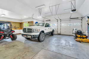 Garage featuring a garage door opener