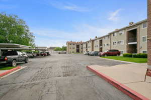 View of asphalt street featuring curbs