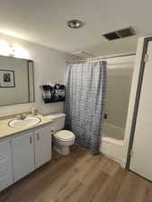Bathroom featuring new LVP floors, , and shower / bath combo