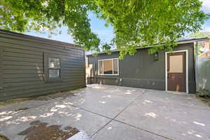 View of patio featuring an outbuilding