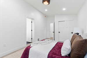 Owners Suite: Bedroom featuring baseboards, a closet, and recessed lighting