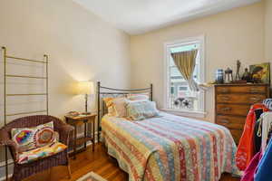 Bedroom with wood finished floors
