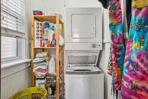 Laundry area featuring stacked washer / dryer
