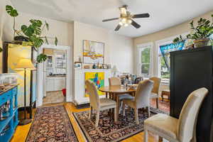 Dining room featuring plenty of natural light, light wood-style flooring, and a ceiling fan