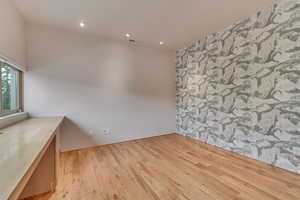 Bedroom with builtin desk. Would make a great office/bedroom.