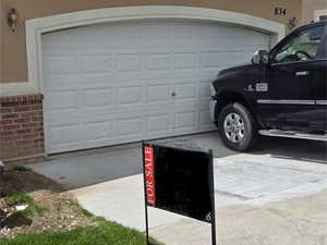 Garage with concrete driveway