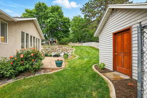 View of yard featuring a patio area and storage shed