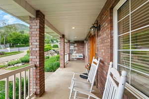 View of front with covered porch and a mountain view