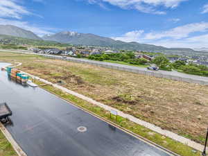 View of mountain backdrop featuring nearby suburban area