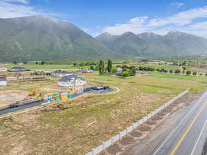View of mountain backdrop with rural landscape